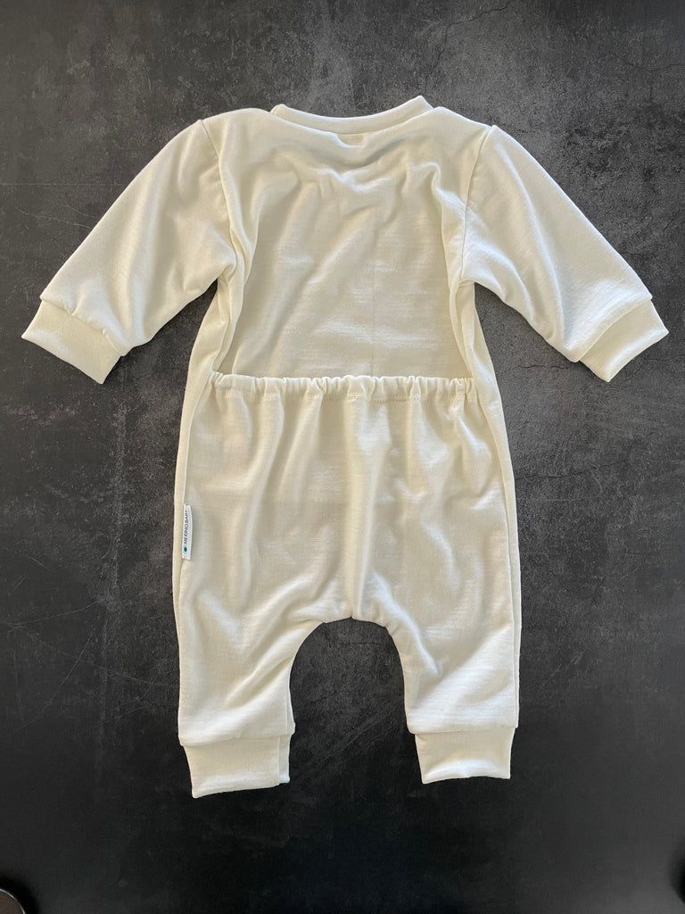 Flat lay view of a merino onsies with cuffs at the ankles